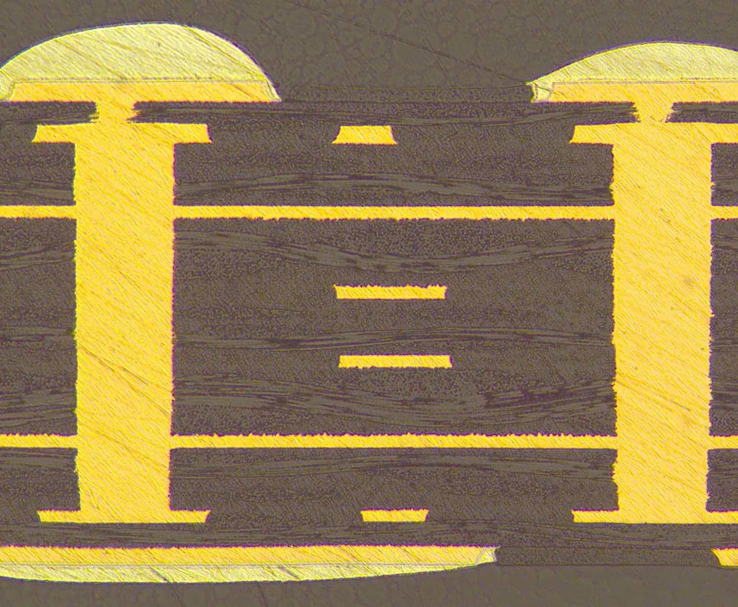 Microscopy cross-section of copper-filled blind vias in a high-density PCB, demonstrating precise laser drilling and uniform copper deposition from surface pad into internal layers.