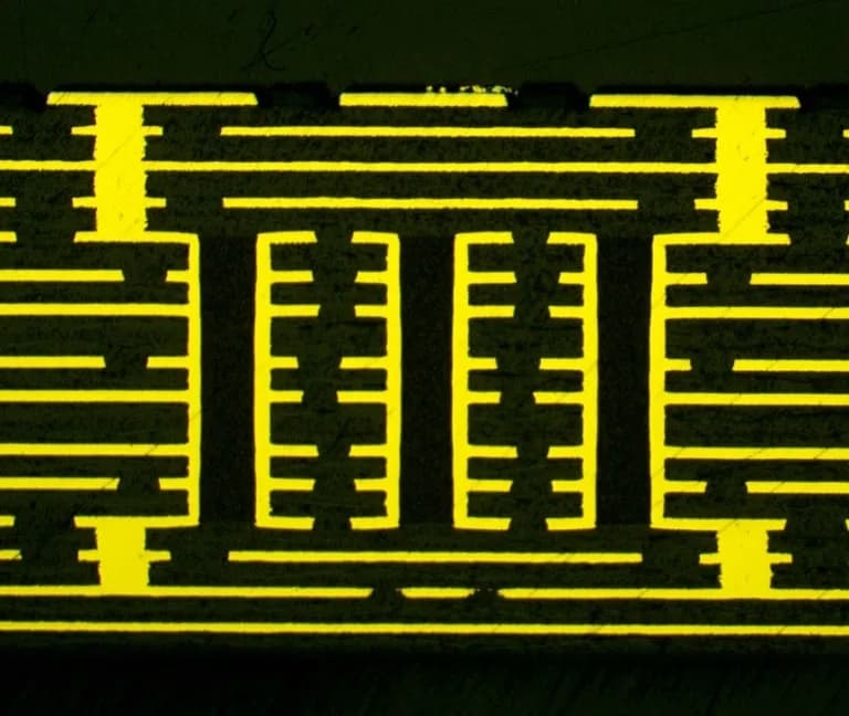 Microscopy cross-section showing laser-drilled microvia formation in a printed circuit board, with copper-plated via structures visible against a dark substrate.