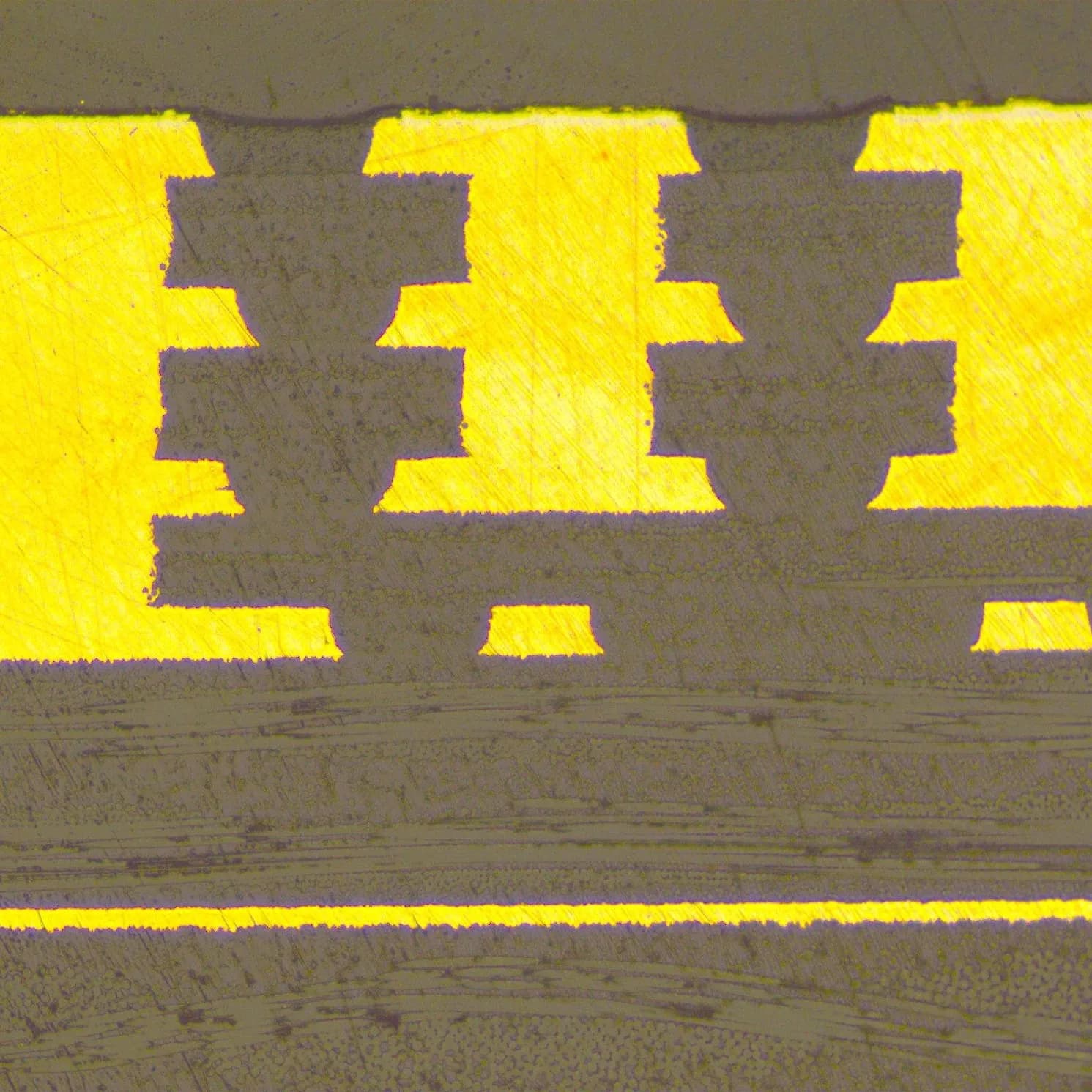 Microscopic cross-section analysis of three stacked copper microvias spanning multiple layers in an HDI board.