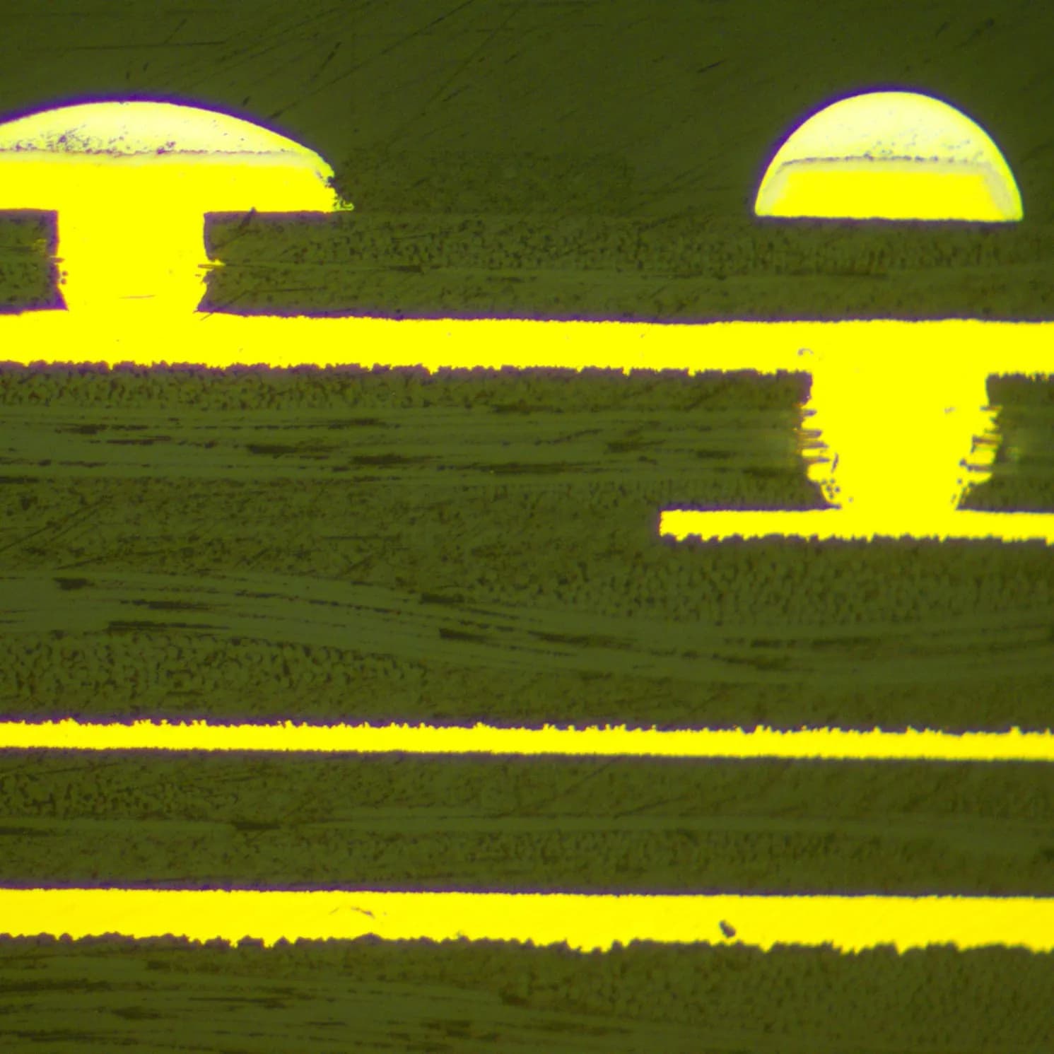 Microscope cross-section showing staggered copper-filled microvias with plated copper caps on an HDI circuit board.